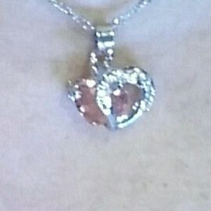 One left Pink and sterling silver heart necklace